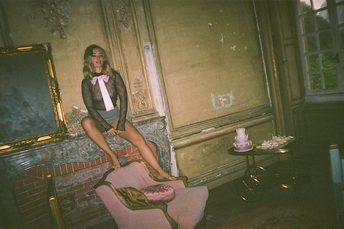 Fleur Van der Hoeven sitting on fire mantle